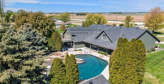 view from above of property featuring a pool area