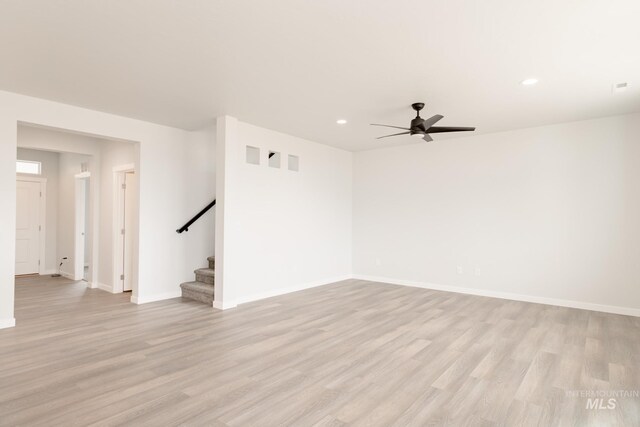 spare room featuring light colored carpet