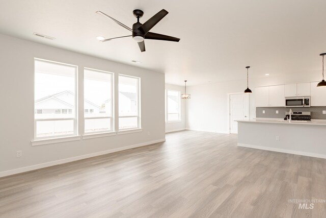 unfurnished bedroom with light carpet and a closet