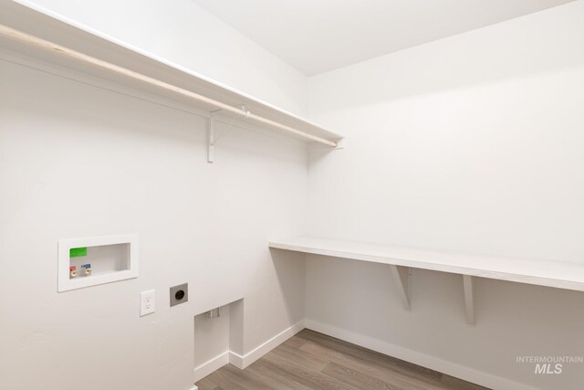 bathroom with vanity, an enclosed shower, and hardwood / wood-style floors