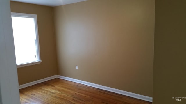 spare room with light hardwood / wood-style floors