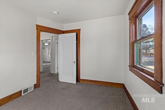 unfurnished bedroom featuring carpet