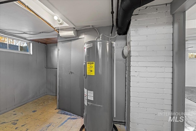 utility room with electric water heater