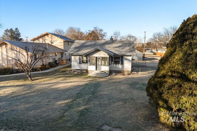 bungalow with a front lawn