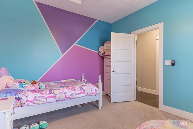 bedroom featuring visible vents, carpet flooring, and baseboards