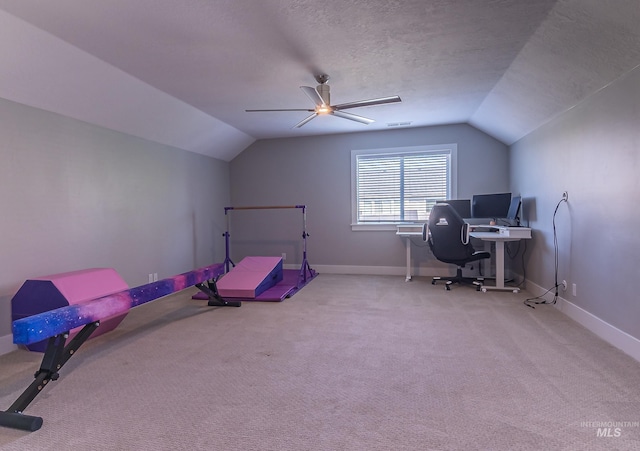 office area with lofted ceiling, a textured ceiling, ceiling fan, baseboards, and carpet