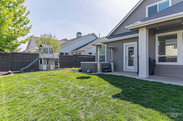 view of yard featuring cooling unit, a fenced backyard, a patio area, and a playground