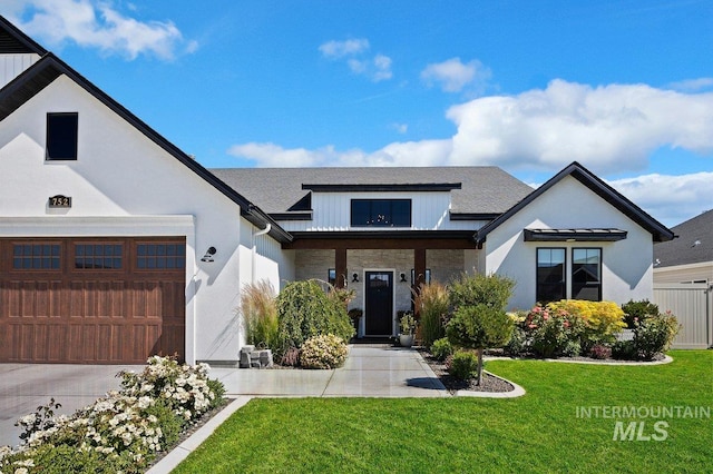 modern farmhouse featuring a front yard, a garage, stucco siding, and concrete driveway