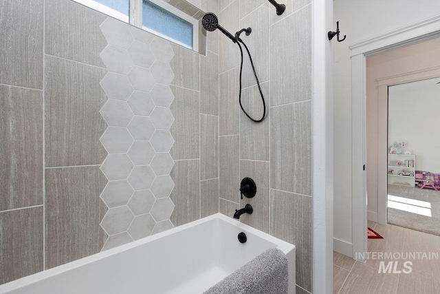 bathroom with shower / washtub combination