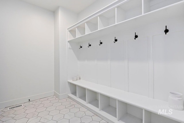 mudroom featuring baseboards
