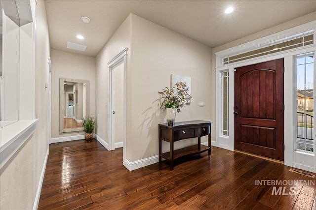 entrance foyer featuring dark wood finished floors, visible vents, recessed lighting, and baseboards