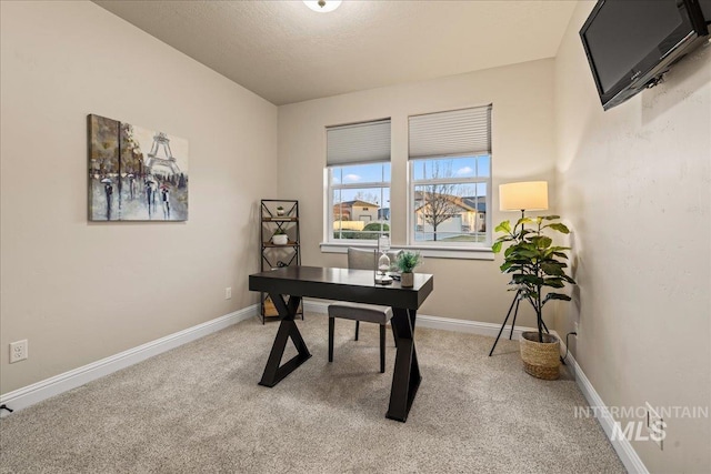 carpeted office with baseboards