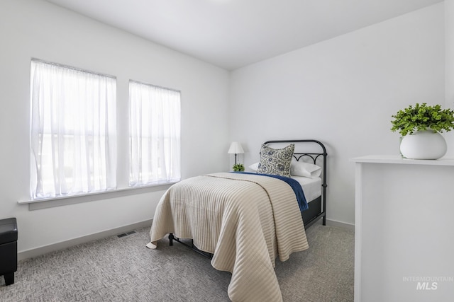 bedroom with visible vents, baseboards, and carpet floors