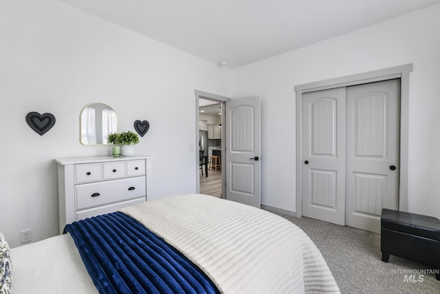 bedroom with carpet and a closet
