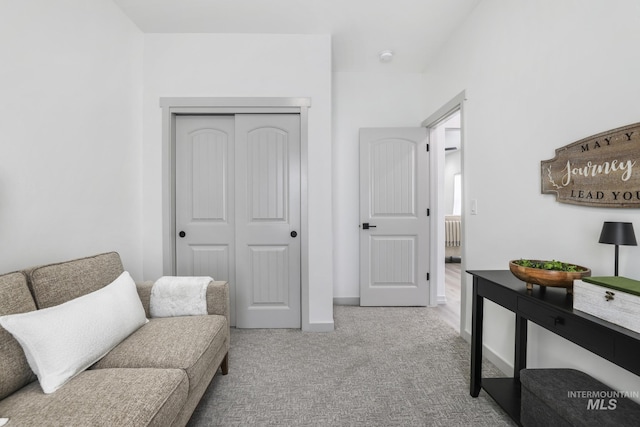 living area with carpet flooring