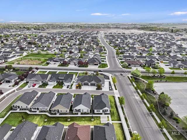birds eye view of property with a residential view