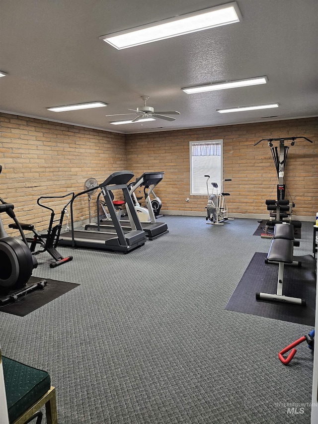 319 N Westminster St, Nampa, ID 83651 - exercise room featuring carpet floors, ceiling fan, a textured ceiling, and brick wall