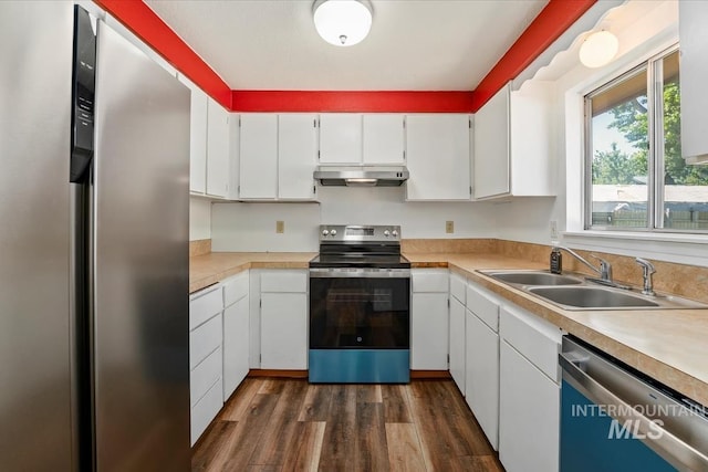 1919 S Banner St, Nampa, ID 83686 - kitchen featuring appliances with stainless steel finishes, under cabinet range hood, a sink, light countertops, and white cabinets