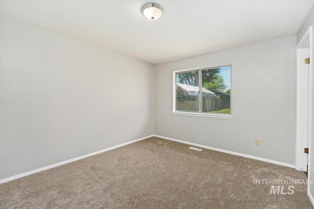1919 S Banner St, Nampa, ID 83686 - carpeted empty room featuring baseboards