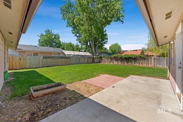 1919 S Banner St, Nampa, ID 83686 - view of yard with a patio area and a garden