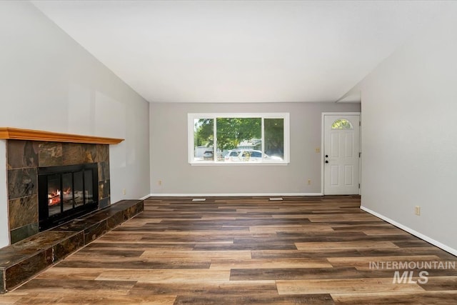 1919 S Banner St, Nampa, ID 83686 - unfurnished living room with wood finished floors, a fireplace, and baseboards