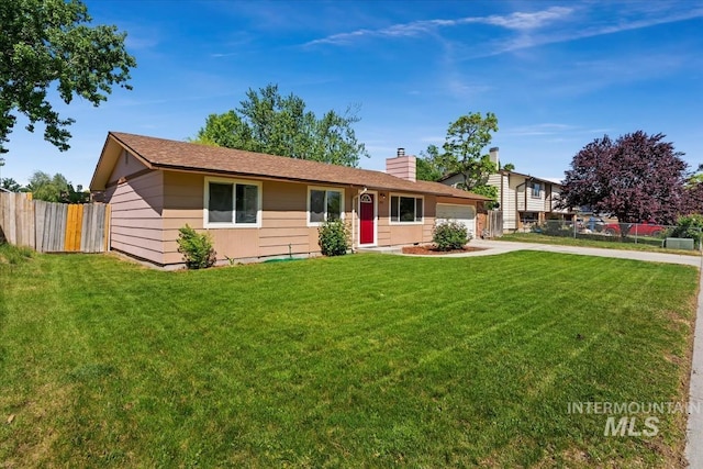 1919 S Banner St, Nampa, ID 83686 - view of front of property featuring a chimney, a garage, and driveway