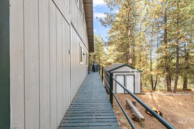 view of property exterior featuring an outbuilding and a shed