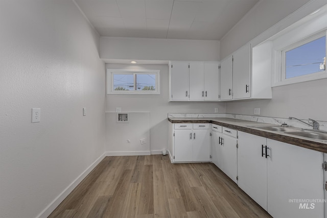 36 W Liberty, Weiser, ID 83672 - laundry area with cabinet space, light wood-style flooring, and hookup for a washing machine