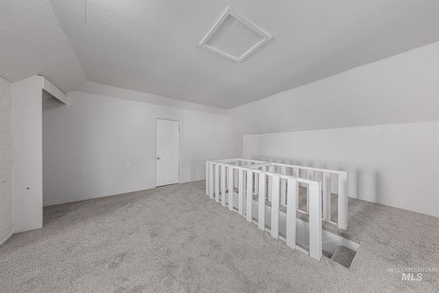 36 W Liberty, Weiser, ID 83672 - bonus room with vaulted ceiling, carpet floors, and attic access