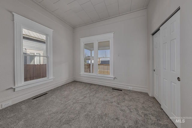 36 W Liberty, Weiser, ID 83672 - empty room with ornamental molding, plenty of natural light, and carpet flooring