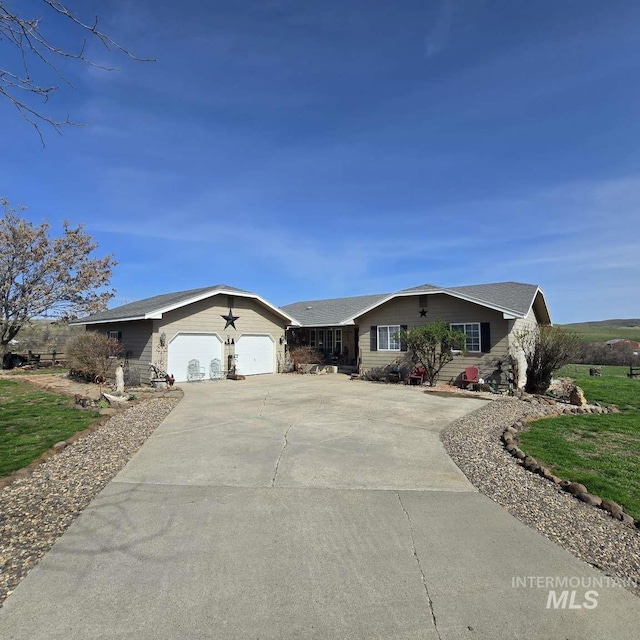 1280 Monroe Creek Rd, Weiser, ID 83672 - single story home with concrete driveway and a garage