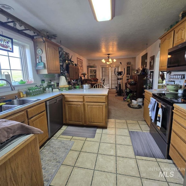 1280 Monroe Creek Rd, Weiser, ID 83672 - kitchen with stainless steel appliances, a peninsula, a sink, and brown cabinets