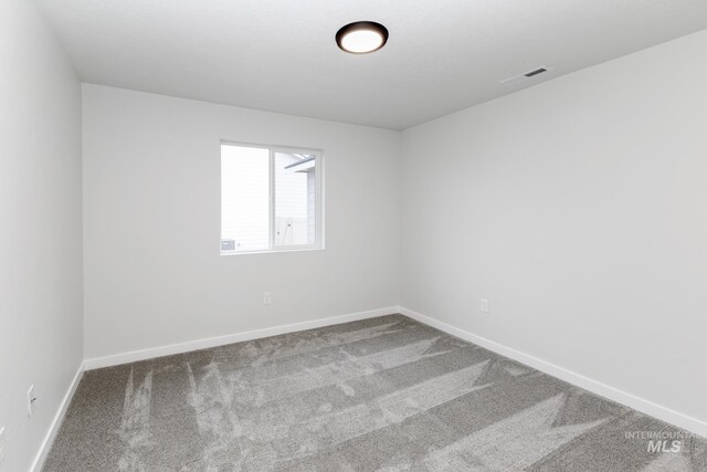 5303 E Grizzly St, Nampa, ID 83687 - carpeted spare room featuring baseboards