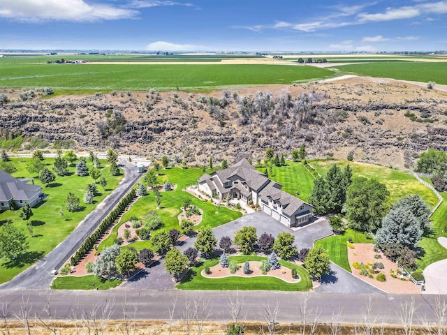 birds eye view of property featuring a rural view