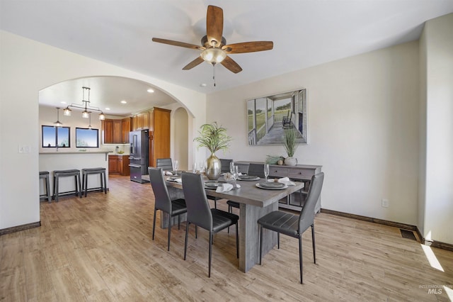 dining area featuring ceiling fan and light hardwood / wood-style floors