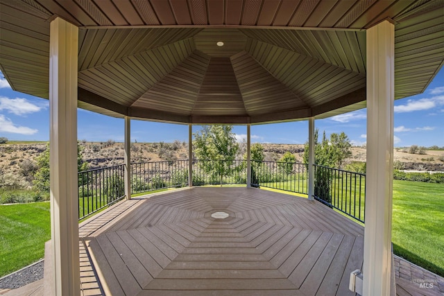 deck with a gazebo and a lawn