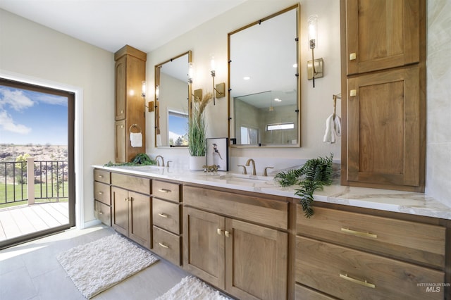 bathroom with tile patterned flooring and vanity