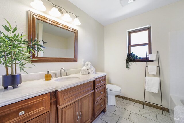 bathroom featuring vanity and toilet