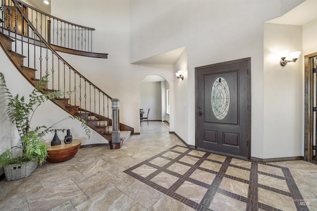 entryway with a high ceiling