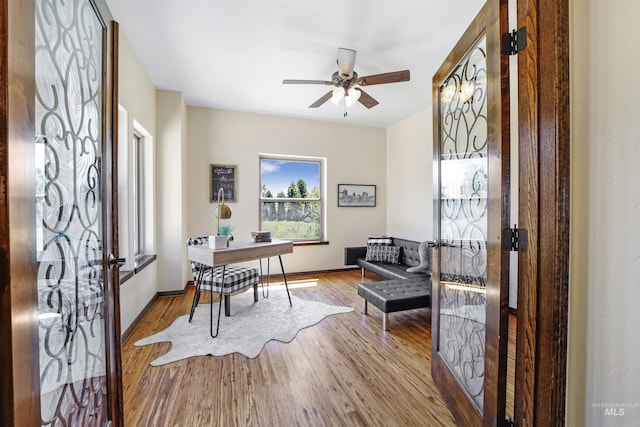 office area with ceiling fan and light wood-type flooring