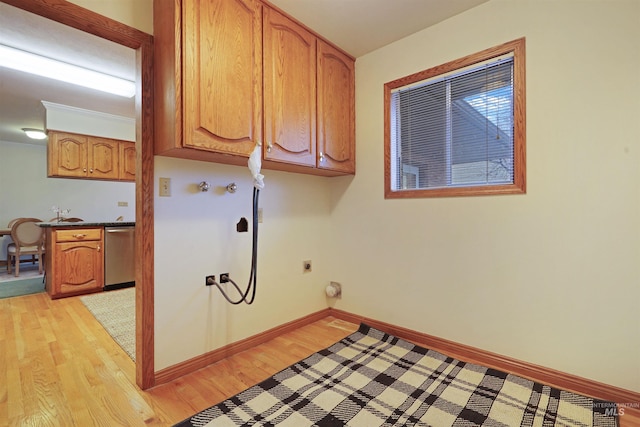 435 W 24th St, Burley, ID 83318 - washroom with cabinets, hookup for an electric dryer, and light wood-type flooring