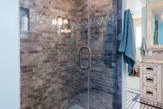 full bathroom with vanity and a stall shower