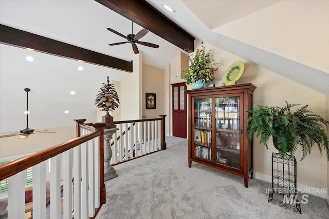hall with recessed lighting, lofted ceiling with beams, an upstairs landing, and light carpet