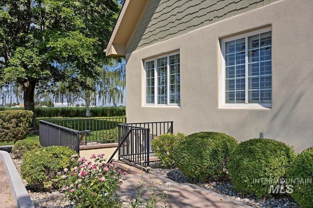 view of side of property featuring stucco siding