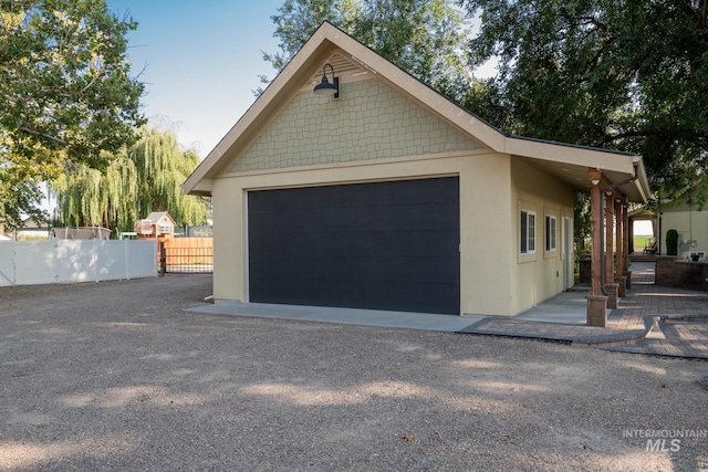 detached garage with fence