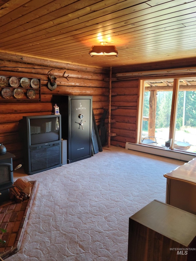 14797 Grangemont Rd, Orofino, ID 83544 - unfurnished living room featuring wooden ceiling, a wood stove, log walls, baseboard heating, and carpet floors