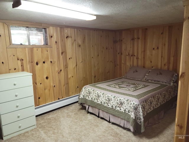 14797 Grangemont Rd, Orofino, ID 83544 - bedroom featuring a baseboard heating unit, carpet floors, wooden walls, and a textured ceiling