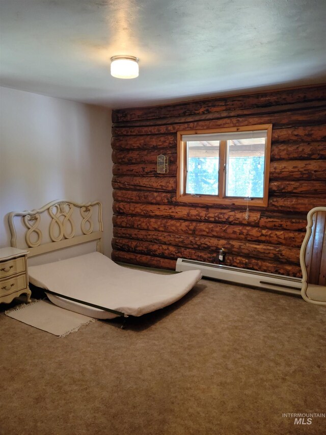 14797 Grangemont Rd, Orofino, ID 83544 - unfurnished bedroom featuring baseboard heating, carpet flooring, and rustic walls