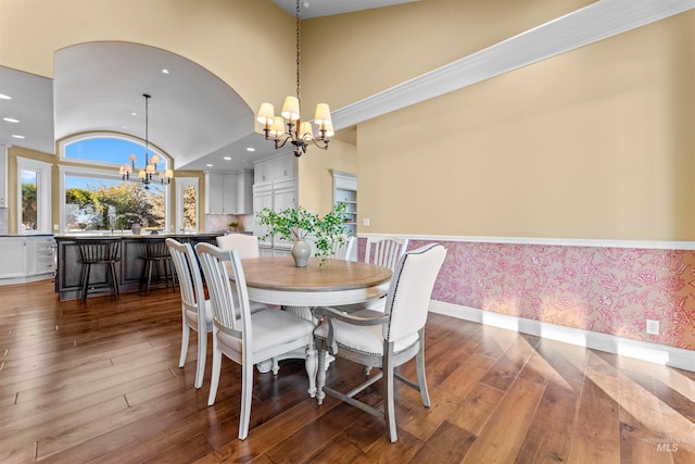 6990 S Skybreak Ln, Meridian, ID 83642 - dining room featuring a notable chandelier, recessed lighting, dark wood-type flooring, baseboards, and wallpapered walls