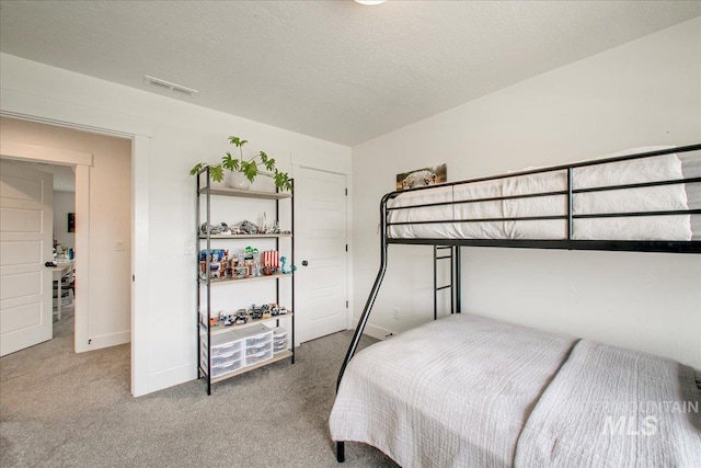carpeted bedroom featuring baseboards